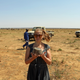 The author holding a freshly-cut piece of rhino horn at a rhino ranch in South Africa.